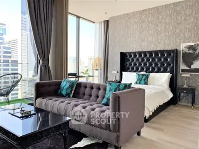 Luxurious modern bedroom with city view, featuring elegant decor and plush furnishings.