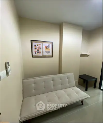 Cozy living room with modern sofa and stylish wall art