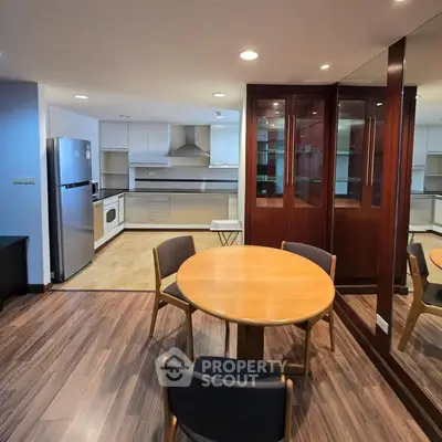 Spacious kitchen with dining area and modern appliances in open layout