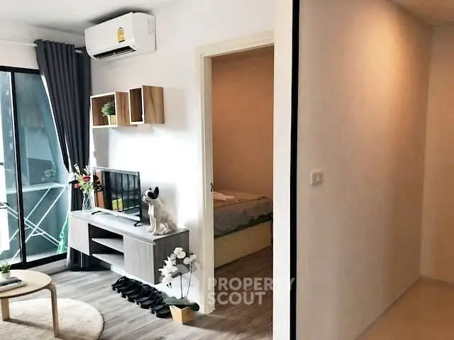 Modern apartment interior with cozy living room and bedroom view