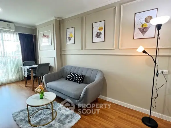 Stylish living room with modern decor and cozy seating area, perfect for relaxation.