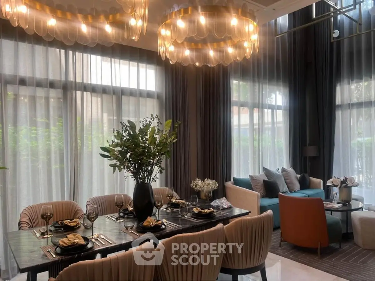 Luxurious dining and living area with elegant lighting and modern decor