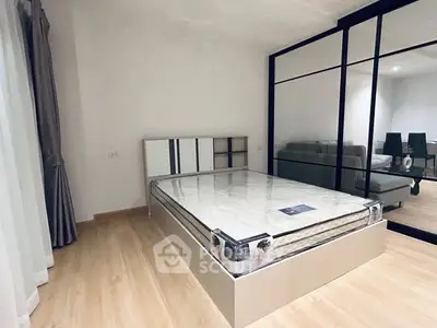 Modern bedroom with glass partition and minimalist design