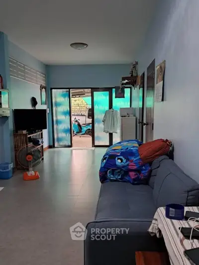 Cozy living room with modern decor and large windows for natural light.