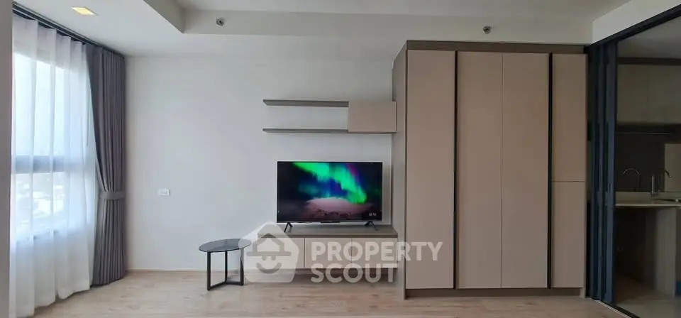 Modern living room with sleek TV setup and minimalist furniture design