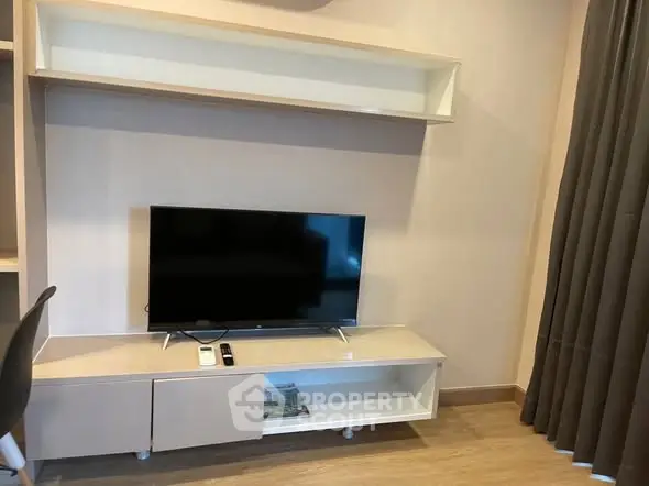 Modern living room with sleek TV unit and elegant decor