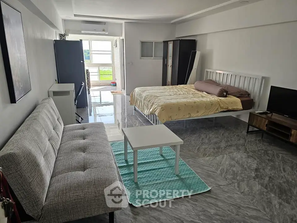 Spacious studio apartment with modern furnishings and natural light