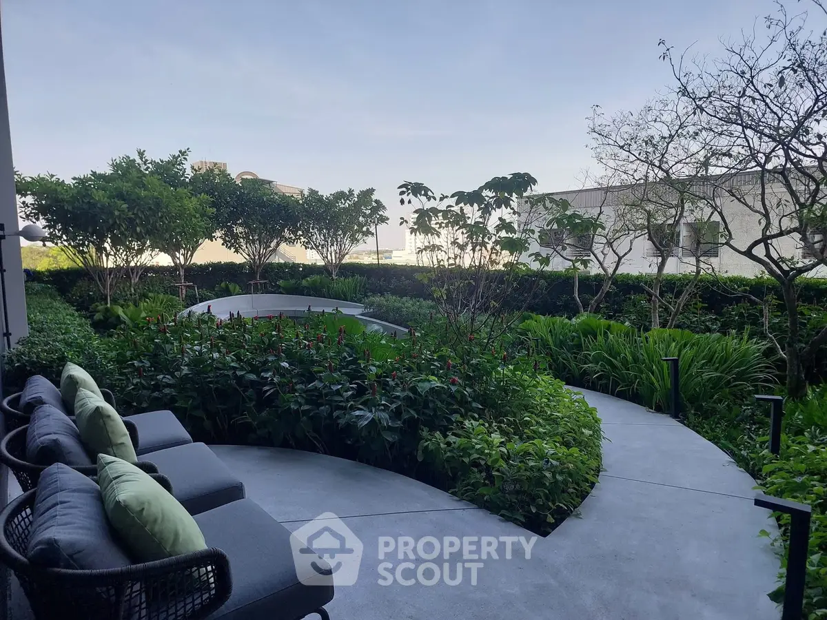 Luxurious garden view with modern outdoor seating in a serene residential setting.