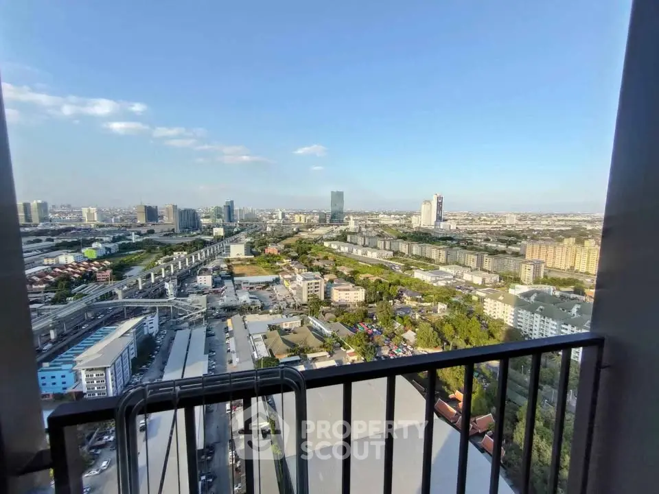 Stunning cityscape view from high-rise balcony with expansive skyline and urban landscape.