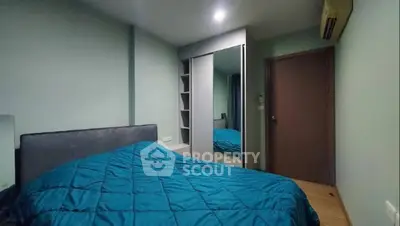 Cozy bedroom with modern design and ample storage space.