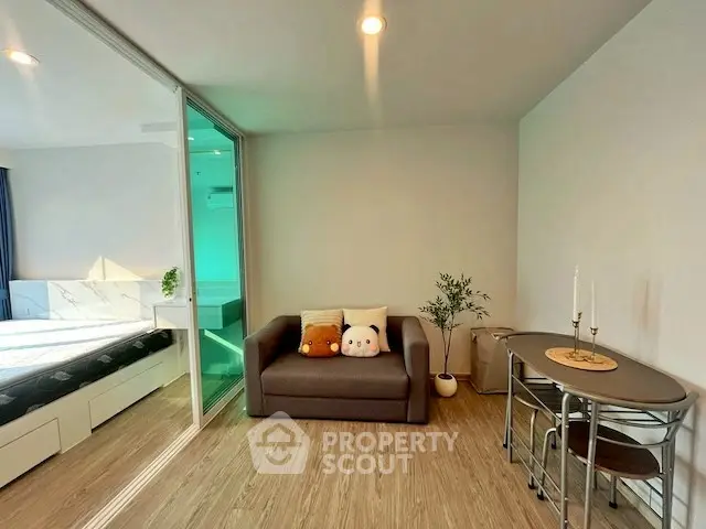 Modern living room with cozy sofa and dining area in stylish apartment