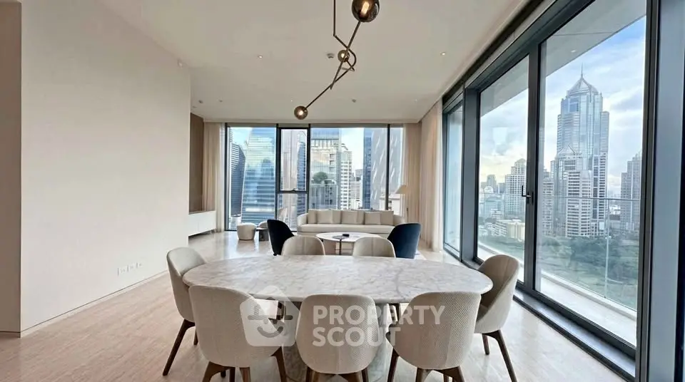 Luxurious modern dining area with stunning city skyline views in high-rise apartment