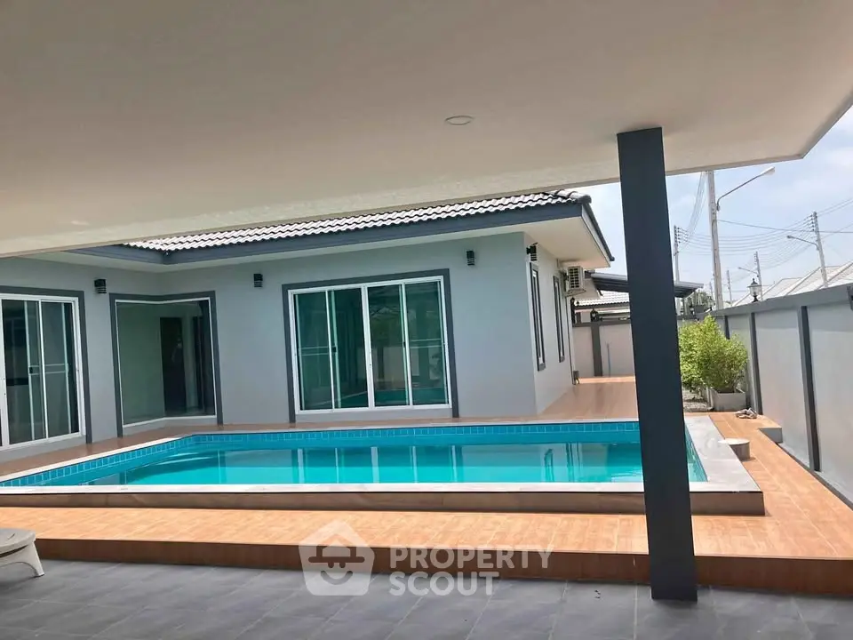 Modern single-story home with private pool and spacious patio area, perfect for relaxation and entertainment.