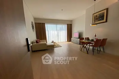 Spacious modern living room with elegant dining area and natural light