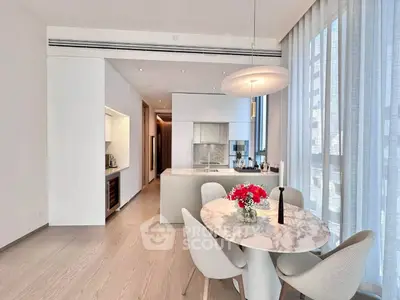Modern kitchen with open layout and elegant dining area in luxury apartment