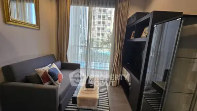 Cozy living room with modern decor and large window view