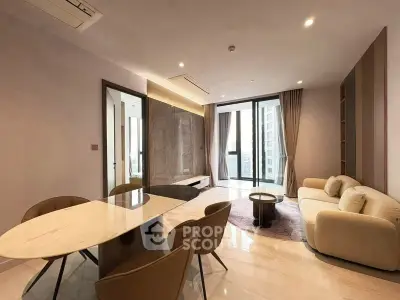 Modern living room with elegant dining area and large windows offering city views.