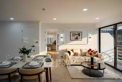 Elegant living room with modern decor and abundant natural light