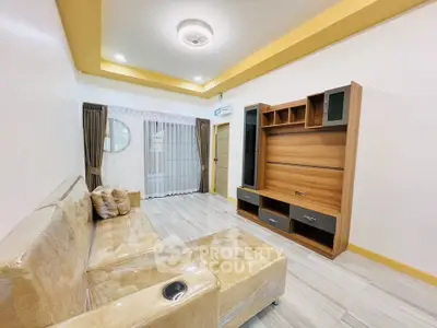 Spacious living room with modern furniture and elegant ceiling design