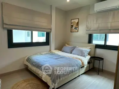 Cozy bedroom with modern decor and natural light