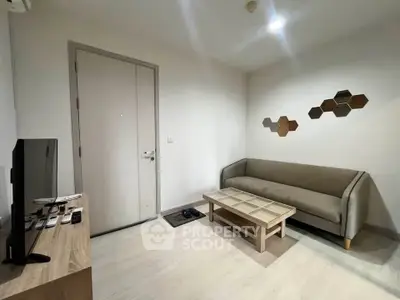 Modern living room with sleek furniture and stylish decor in a cozy apartment.