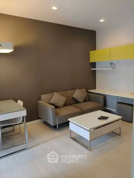 Modern living room with stylish furniture and neutral tones, perfect for cozy relaxation.