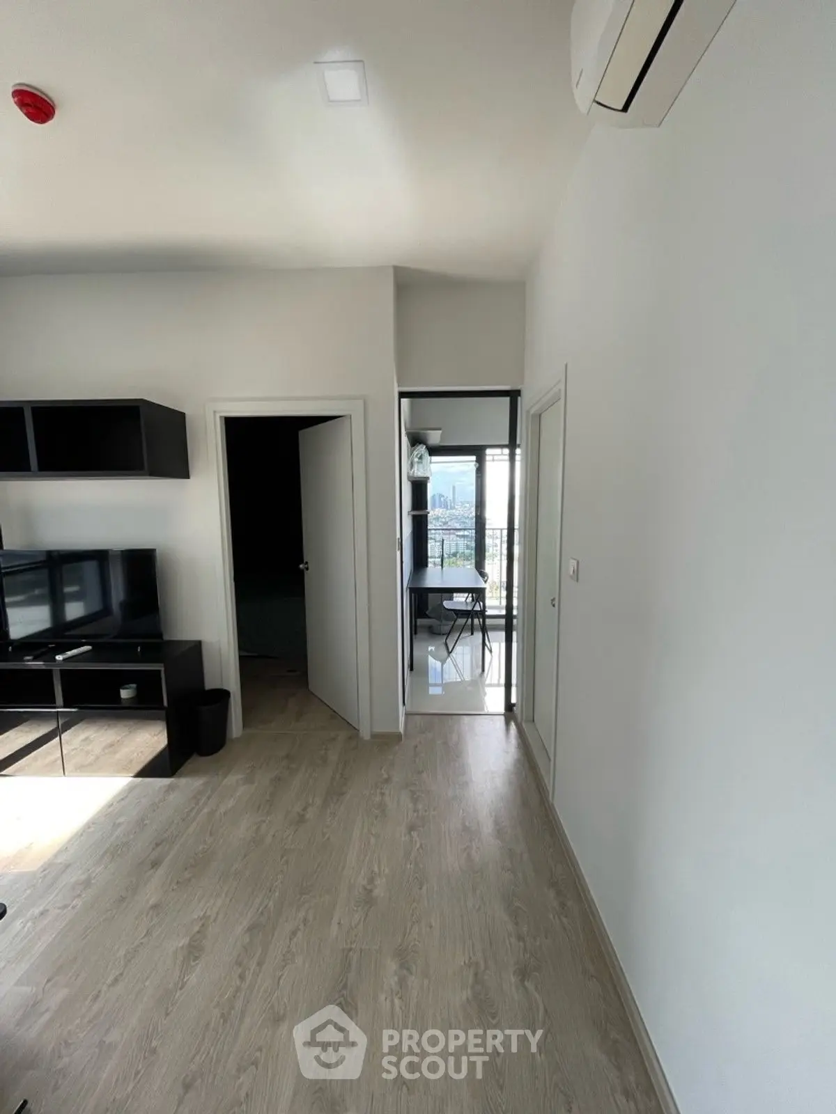 Modern apartment interior with sleek design and balcony view