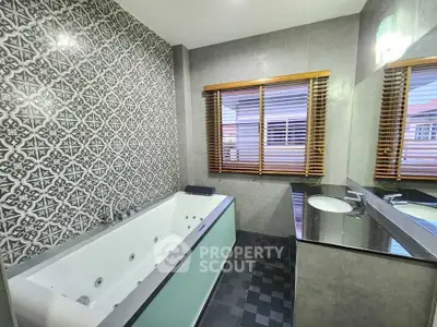 Luxurious bathroom with elegant tile design and modern bathtub
