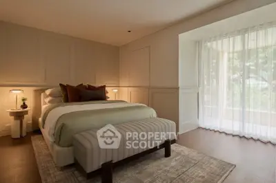 Luxurious bedroom with elegant decor and large window view