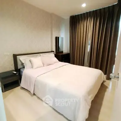 Cozy bedroom with elegant decor and soft lighting, perfect for relaxation and comfort.