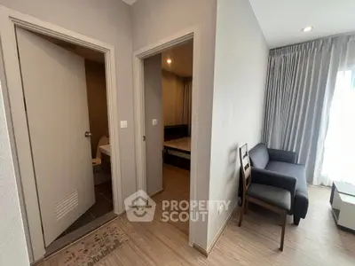 Modern apartment interior with cozy living area and bedroom entrance