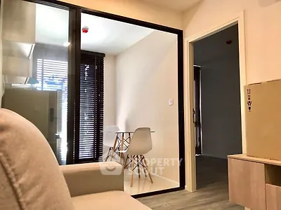 Modern apartment interior with cozy living area and dining space