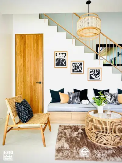 Chic modern living space with stylish staircase, cozy seating area, and tasteful art decor, perfect for urban living and entertaining guests.