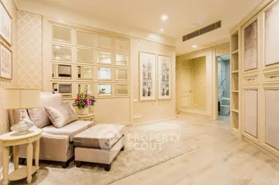 Luxurious living room with elegant decor and plush seating in a sophisticated apartment.