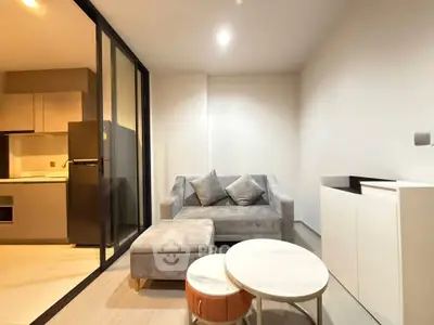 Modern living room with cozy sofa and stylish decor in a contemporary apartment.