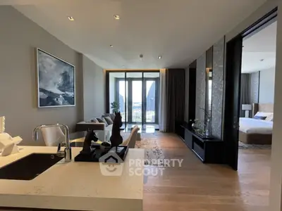 Luxurious open-plan living room with modern kitchen and stunning city view.