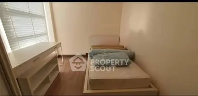 Cozy bedroom with natural light and minimalist furniture