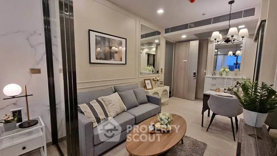 Modern living room with elegant decor and cozy seating area in a stylish apartment.