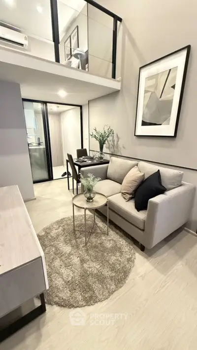 Modern loft-style living room with elegant decor and cozy seating area
