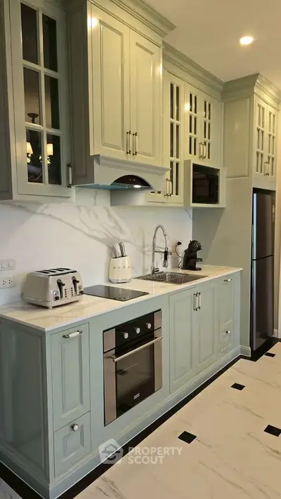 Modern kitchen with elegant cabinetry and built-in appliances