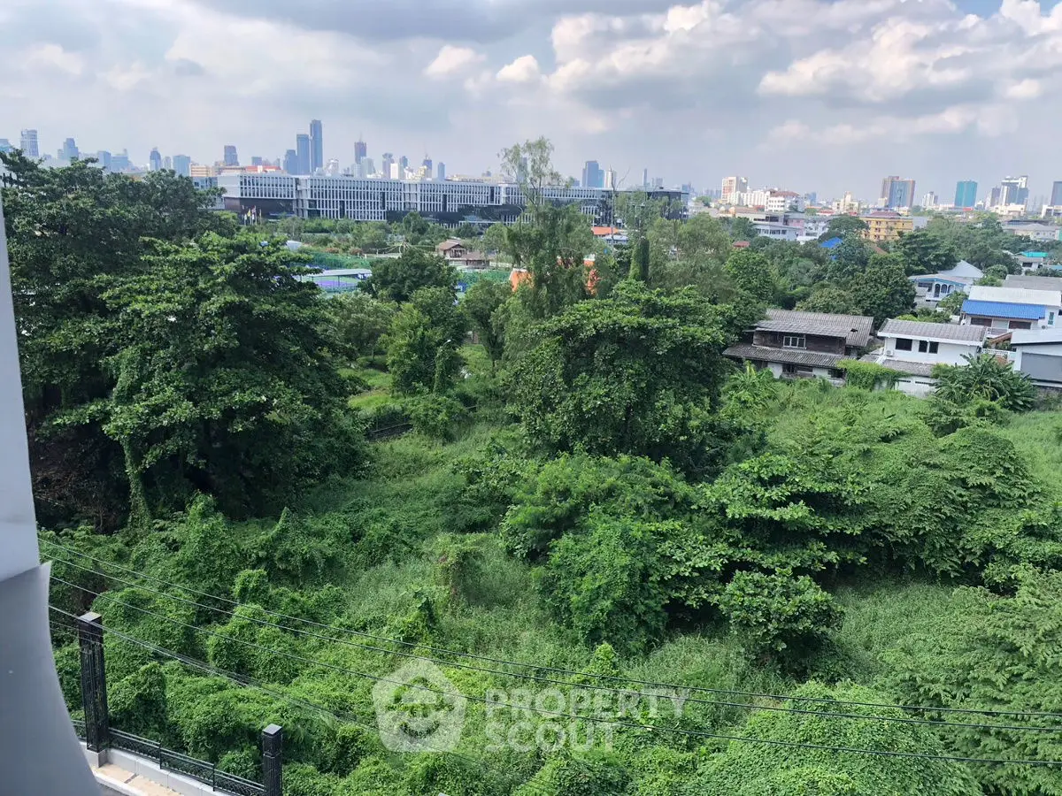 Stunning cityscape view with lush greenery and skyline in the background, perfect for urban nature lovers.
