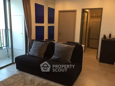 Modern living room with cozy sofa and balcony view in stylish apartment