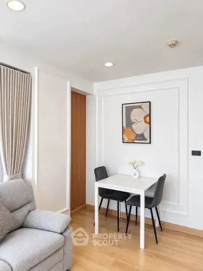Chic modern living room with cozy seating and stylish dining area, perfect for urban living.