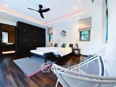 Luxurious modern bedroom with sleek design and wooden flooring