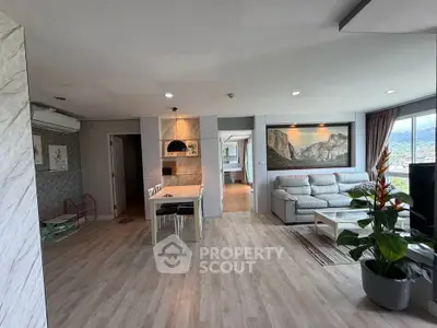 Spacious modern living room with elegant decor and scenic view