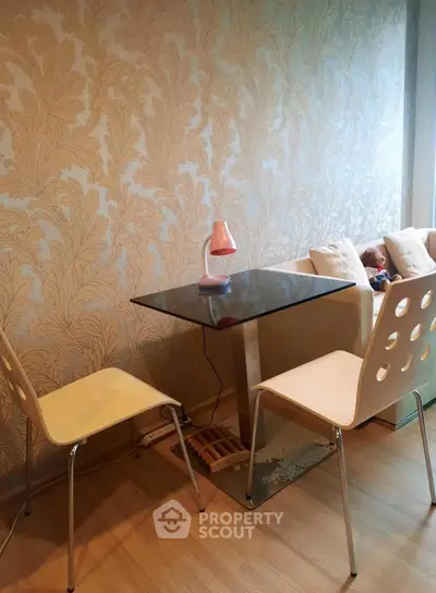 Chic dining nook with modern chairs and glass table in stylish apartment