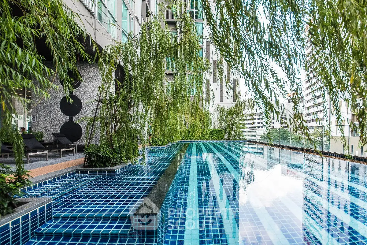 Luxurious rooftop pool with stunning city views and lush greenery