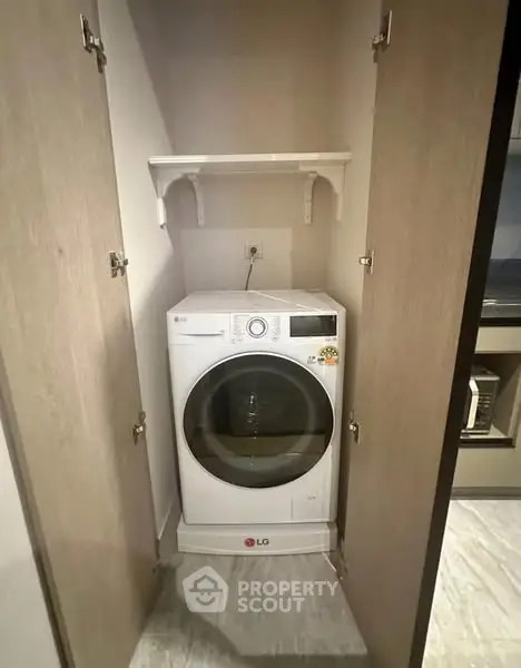 Compact laundry area with LG washing machine in modern home