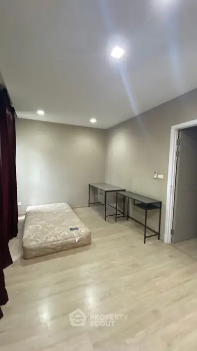 Spacious bedroom with minimalist design and natural light