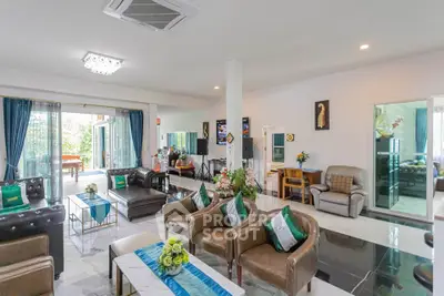 Spacious modern living room with elegant decor and ample natural light
